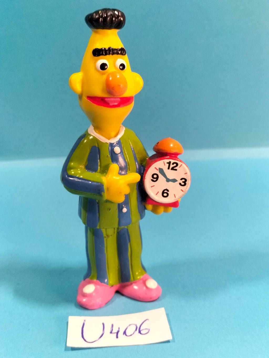 Figura de Barrio Sésamo U406: Reloj despertador pijama de Bert - Henson Muppets Inc