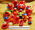 Lot B54: 14 ELMO Sesame Street Henson Figurines &amp; Toys